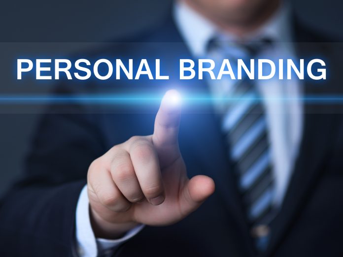 businessman pressing button virtual screens De ce a murit conceptul de branding personal și de ce, astăzi, este mai important ca oricând